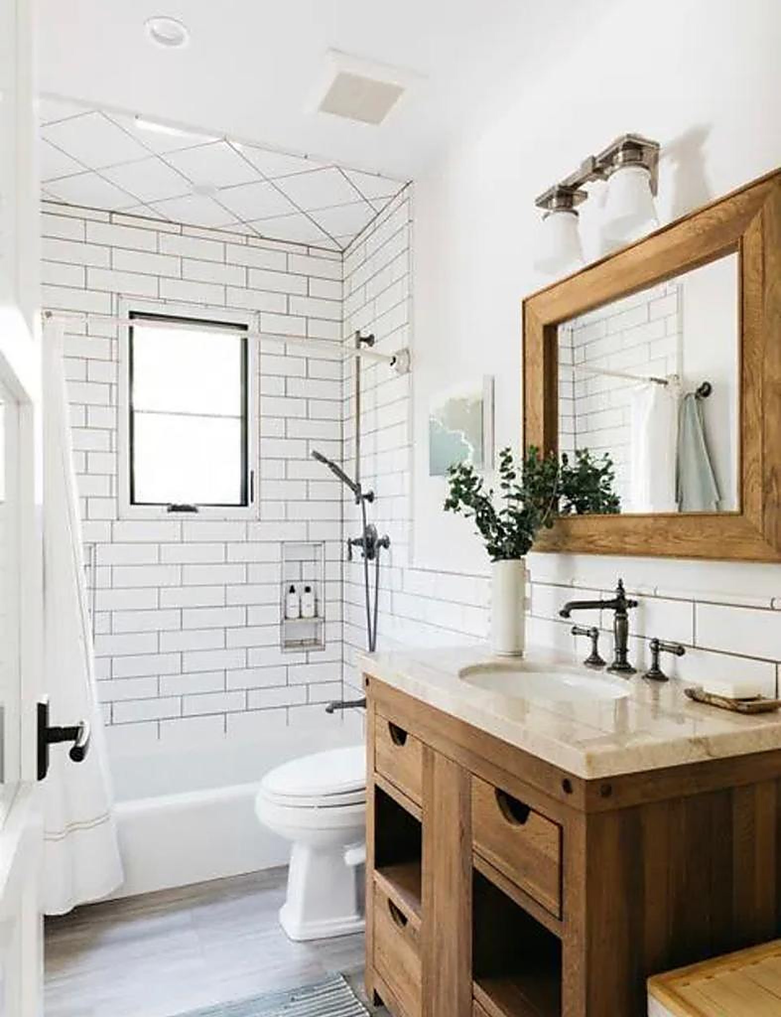 Rustic bathroom with reclaimed wood vanity and subway tile in Santa Monica rental