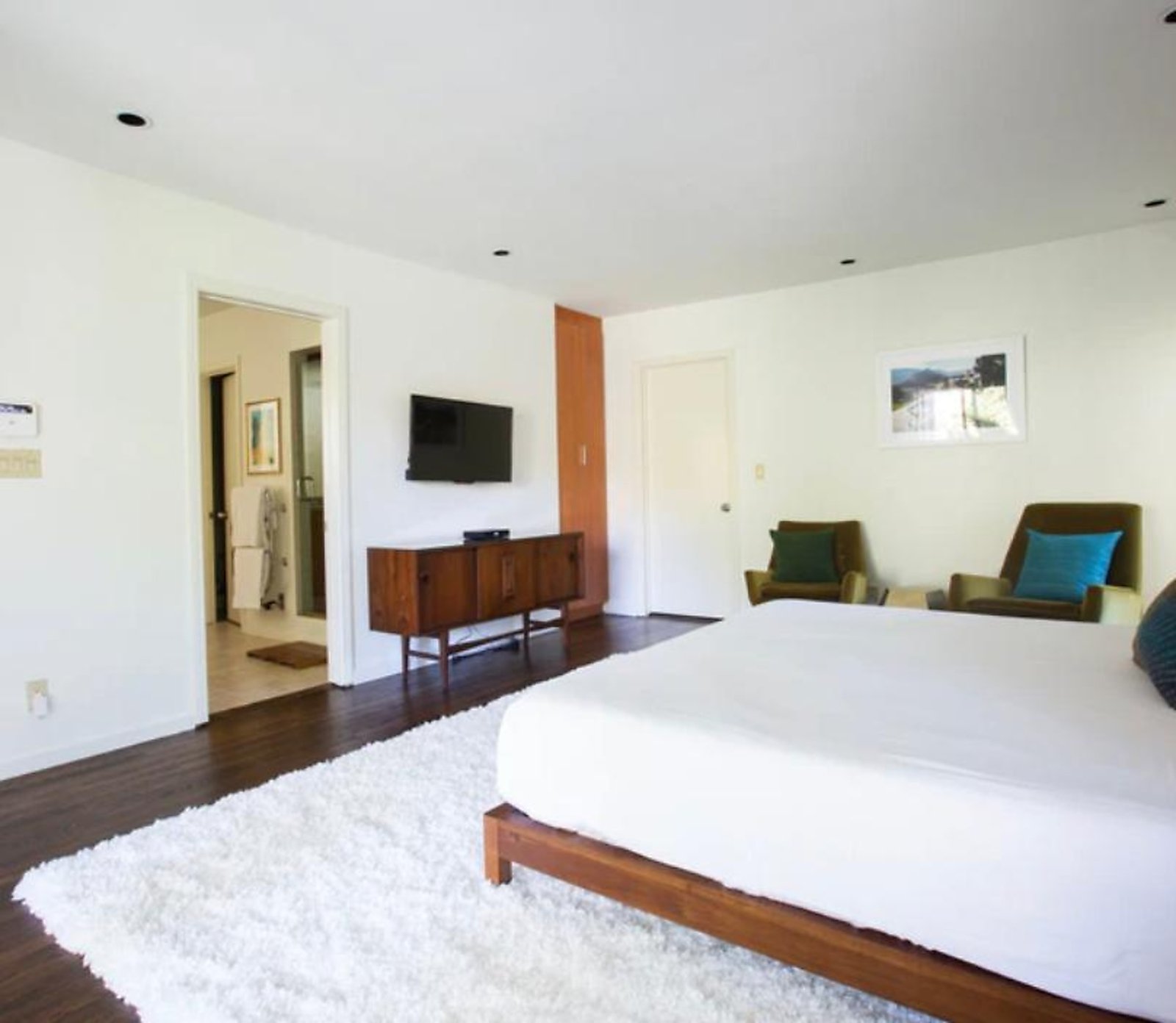 West Hollywood furnished apartment master suite with wall-mounted TV